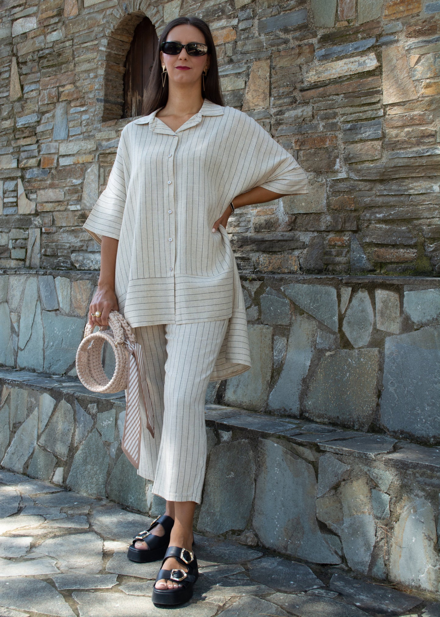 Women's oversized white striped shirt and pants — relaxed fit with clean lines and timeless minimal style