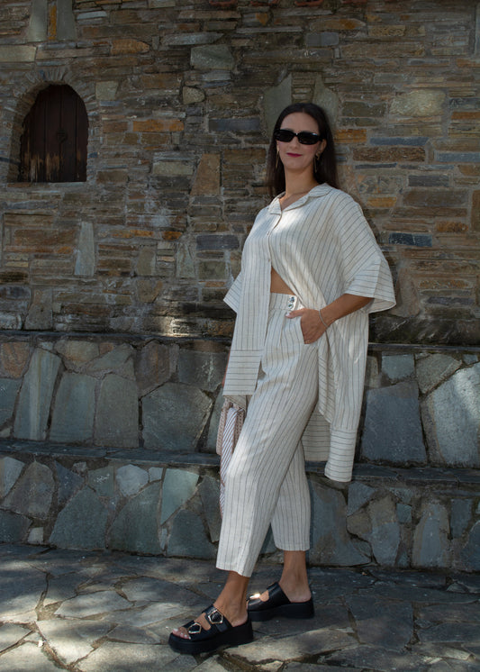 Women's oversized white striped shirt and pants — relaxed fit with clean lines and timeless minimal style