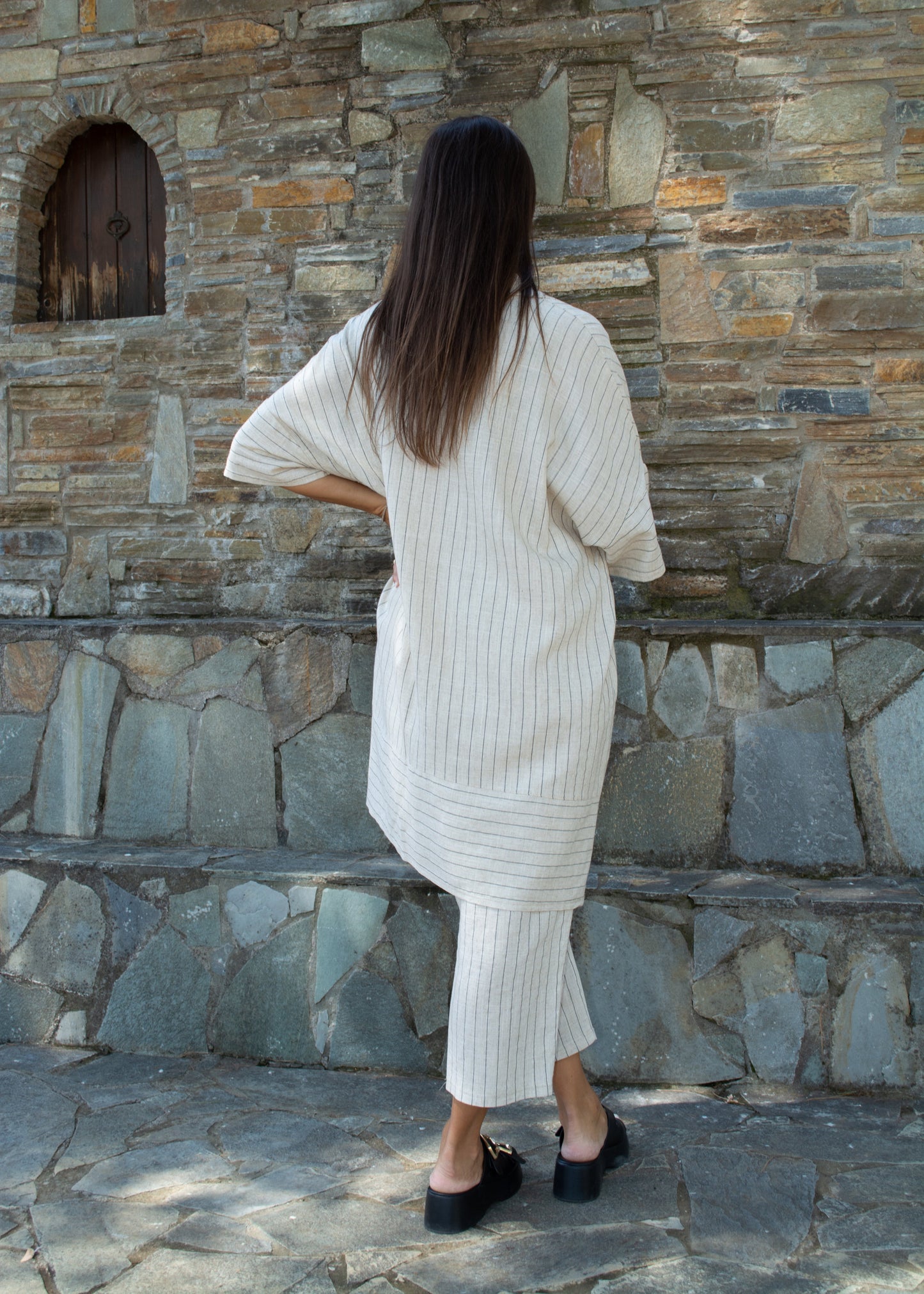 Women's oversized white striped shirt and pants — relaxed fit with clean lines and timeless minimal style