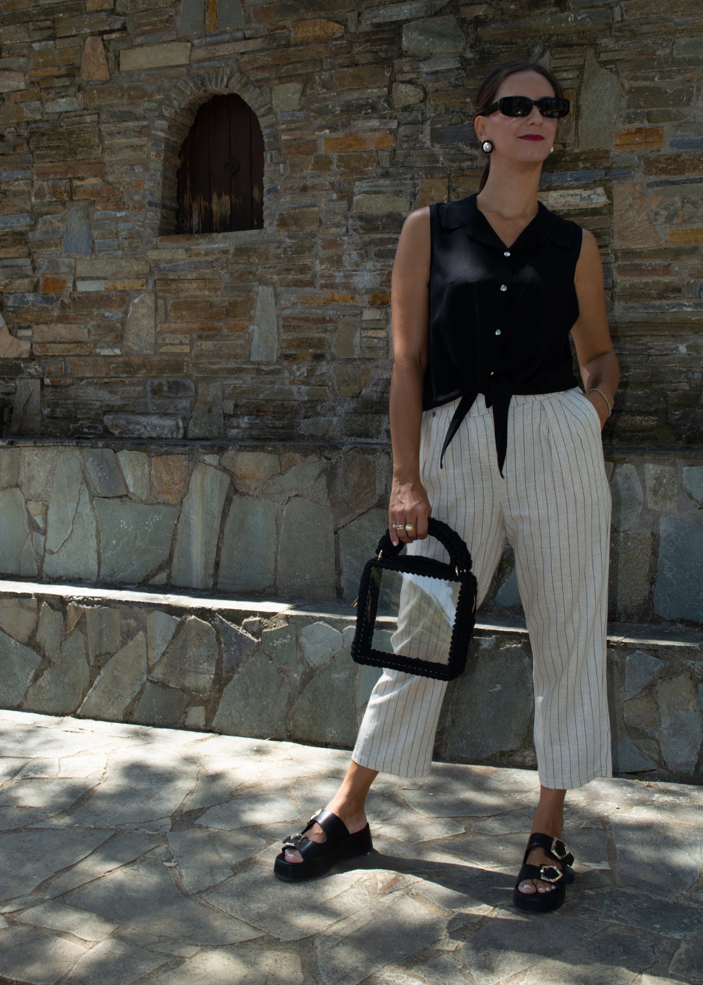 Women's sleeveless top in lightweight tequila fabric, available in black, white, and salmon — perfect for all-day wear and versatile styling.