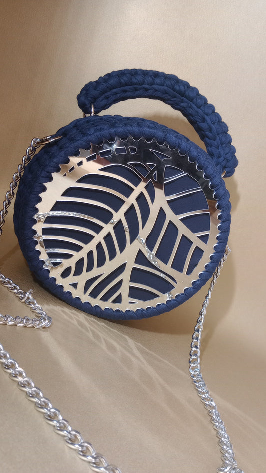 Elegant handmade shoulder crochet bag in soft pop tones, featuring a round embossed design and a metallic accent. Crafted with eco-friendly yarn, lightweight and versatile—ideal for elevating both casual and dressy looks.