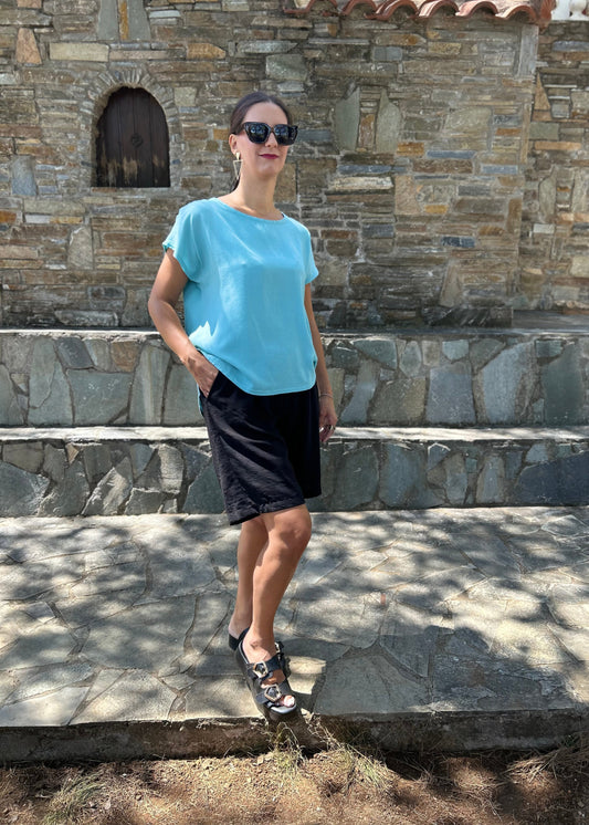 Women top with back button detail — lightweight fabric and clean lines for modern everyday style