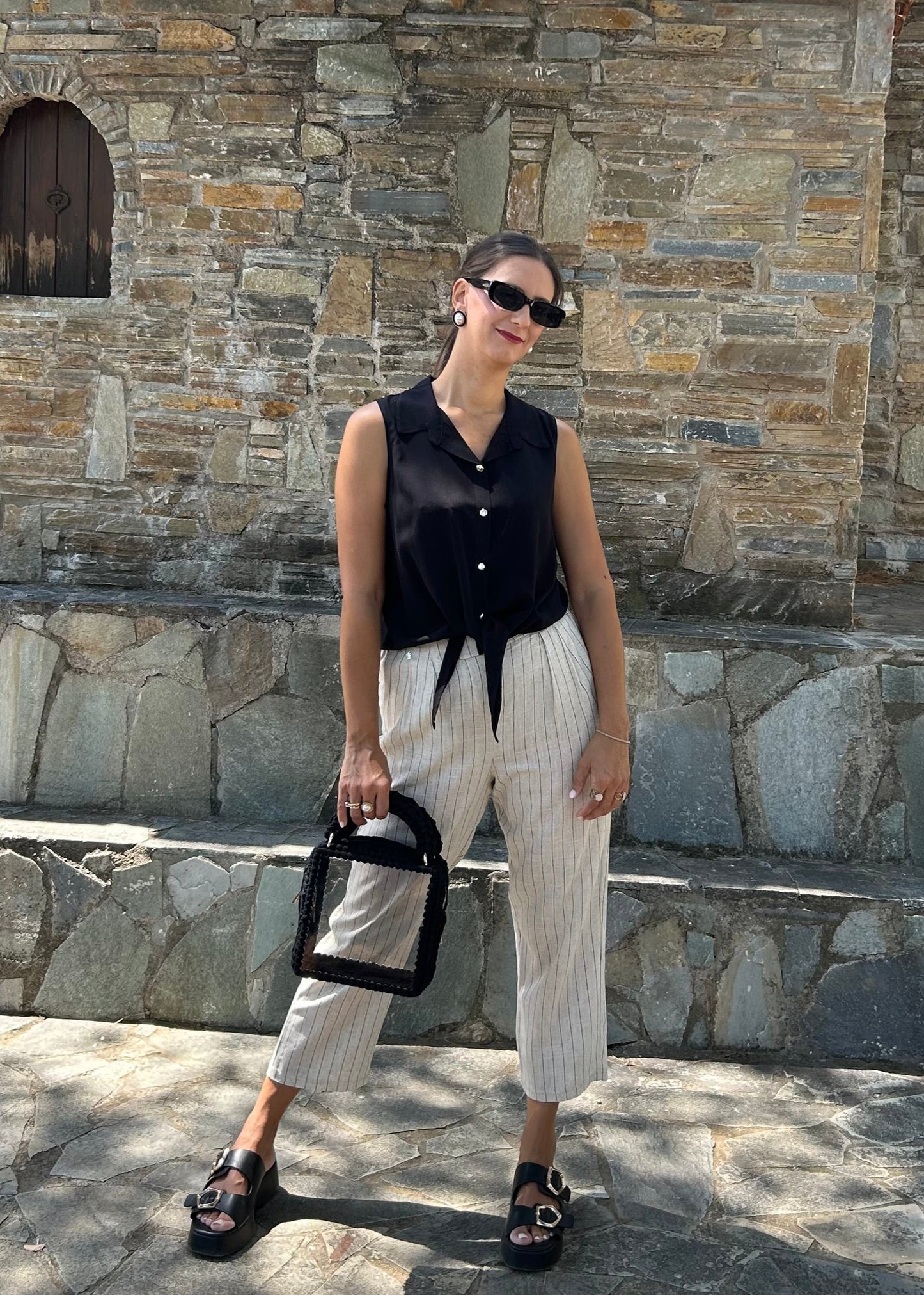 Women's sleeveless top in lightweight tequila fabric, available in black, white, and salmon — perfect for all-day wear and versatile styling.