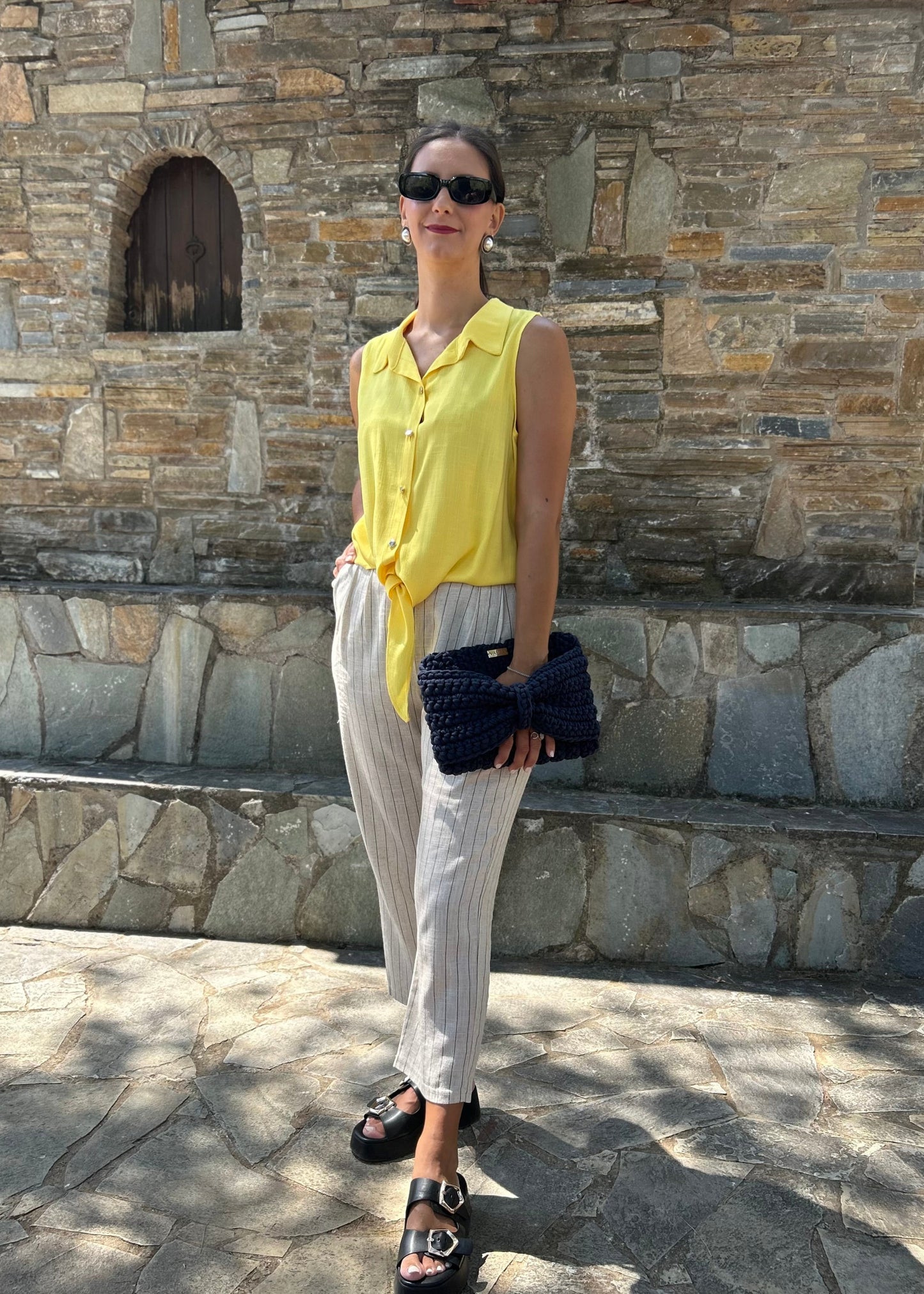Women's sleeveless top in lightweight tequila fabric, available in black, white, and salmon — perfect for all-day wear and versatile styling.