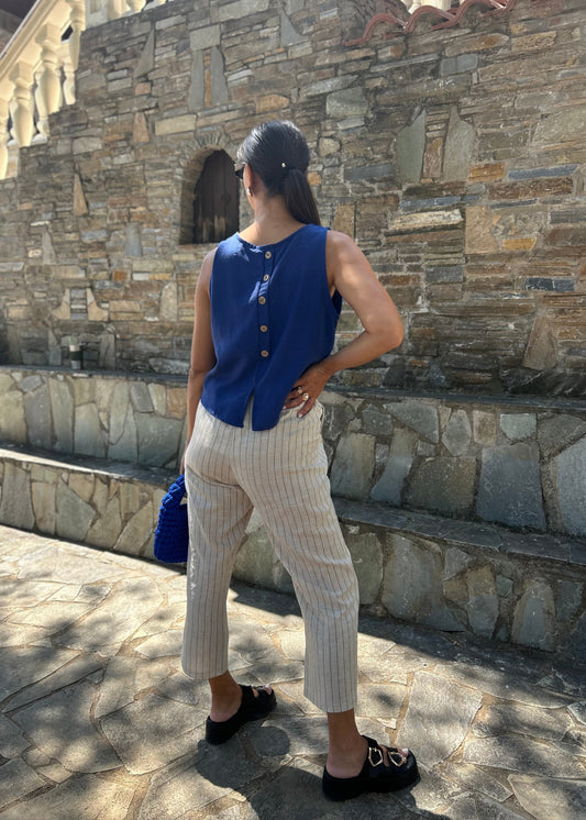 Women's sleeveless tank top with back buttons — lightweight fabric and modern minimal design for everyday wear.