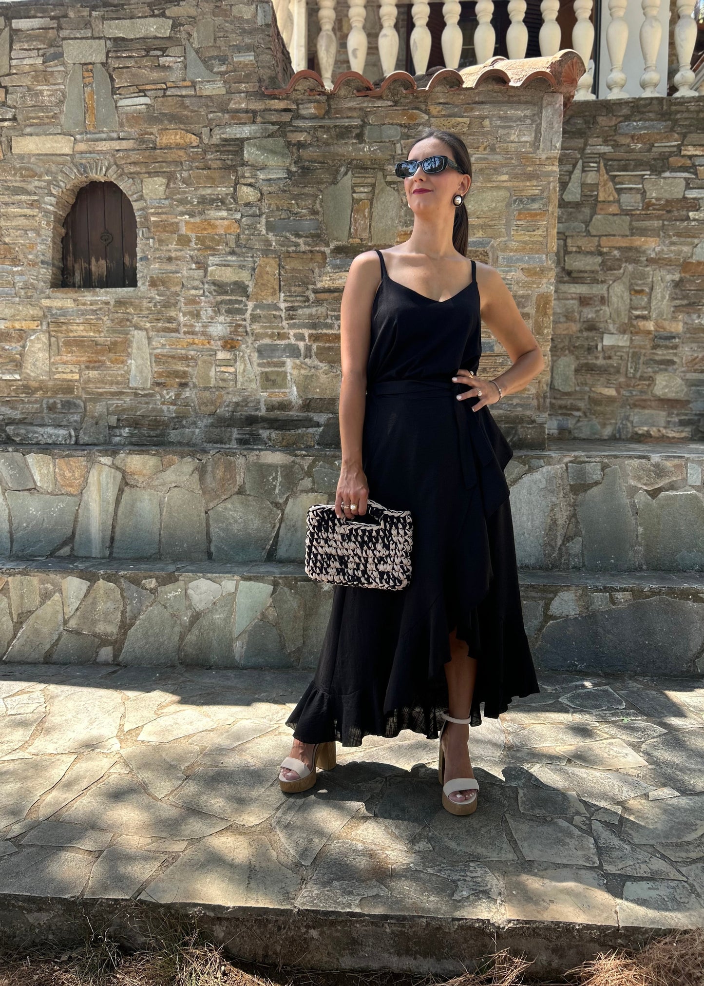 Women's black skirt with side slit and artistic detailing — elegant, feminine, and designed to turn heads.