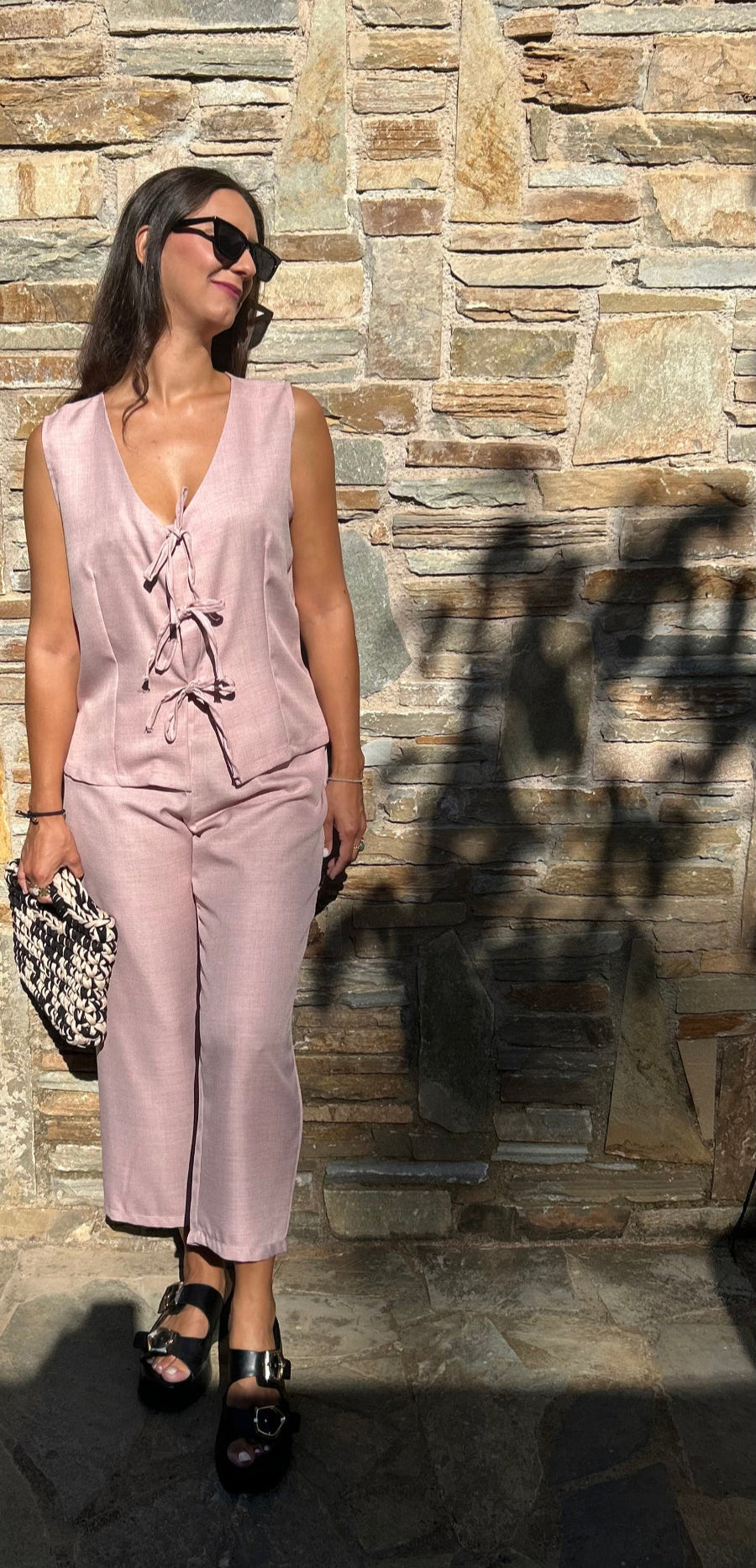 Romantic women's two-piece set featuring a sleeveless top with bow details and a lightweight tequila fabric capri pant with elastic waist – elegant and comfortable for all-day wear