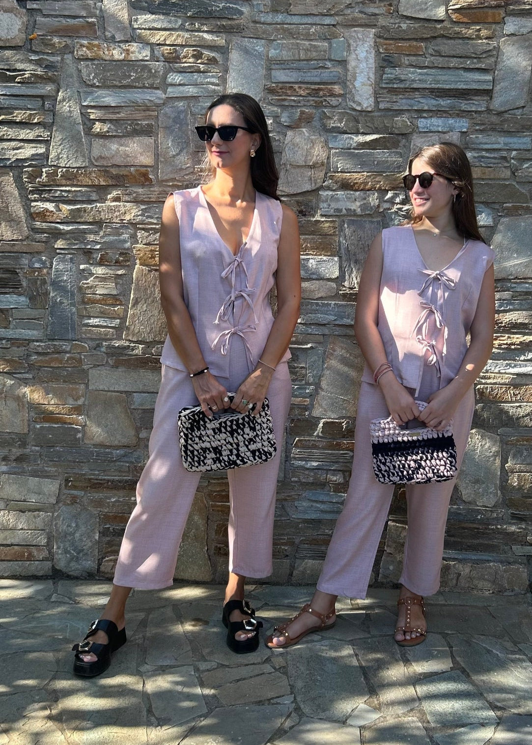 Romantic women's two-piece set featuring a sleeveless top with bow details and a lightweight tequila fabric capri pant with elastic waist – elegant and comfortable for all-day wear