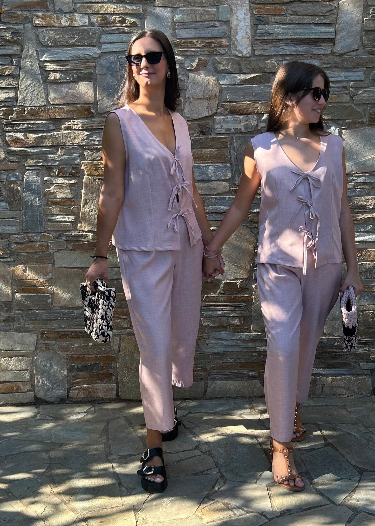 Romantic women's two-piece set featuring a sleeveless top with bow details and a lightweight tequila fabric capri pant with elastic waist – elegant and comfortable for all-day wear