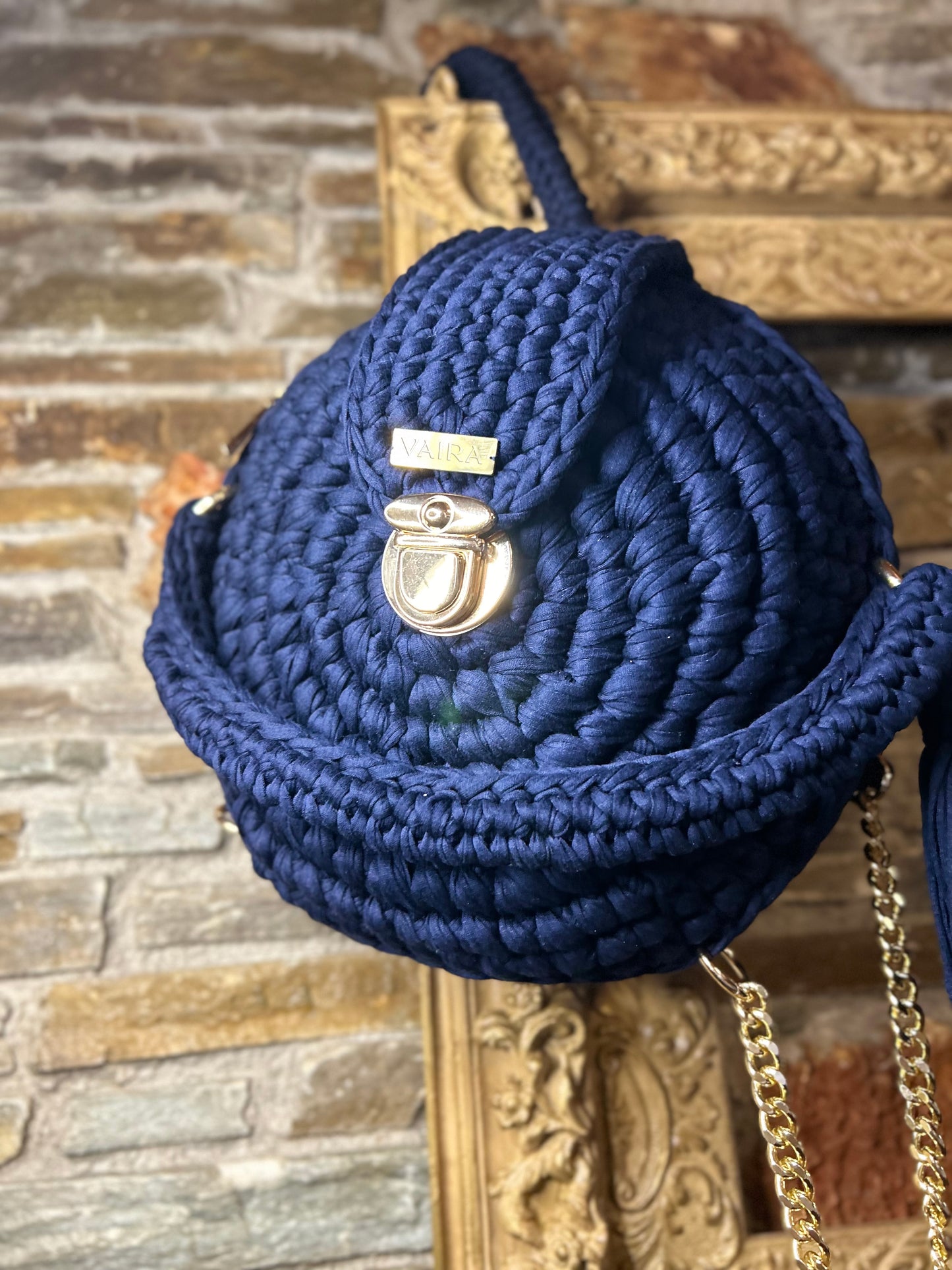 Handmade round blue crochet shoulder bag with matching wallet, featuring a metal and thread strap.