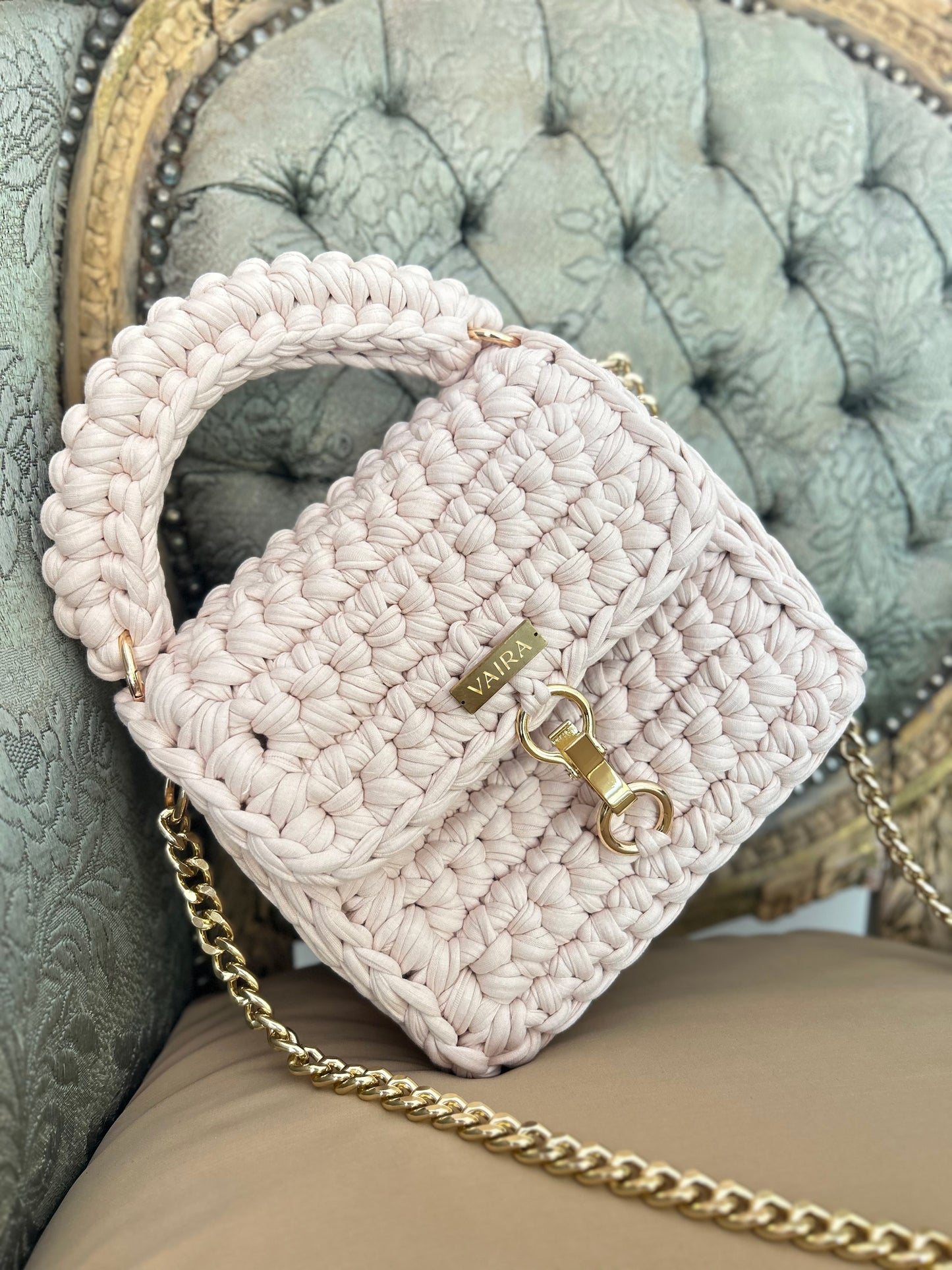 Entirely handcrafted with a unique stitch and golden chain, this petite yet charming shoulder bag brings everyday elegance to life. Perfectly sized for your essentials, it features a standout closure and luxurious texture — a true style statement born from the art of handmade creation.