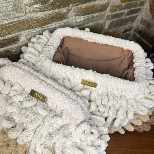 Puffy Bag Soft, plush, and handmade with love. Crafted with eco-friendly velvet yarn and a striking 3D loop stitch, this bag is a true fashion statement.
Available in 3 sizes & a range of stunning shades. Features a metal clasp frame for secure closure. Fully lined interior for both function and finesse.