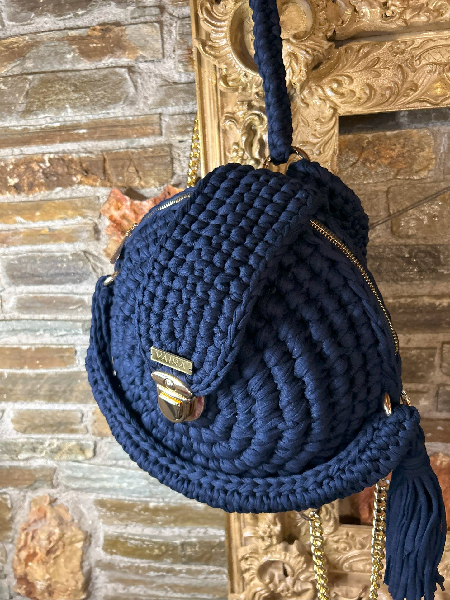 Handmade round blue crochet shoulder bag with matching wallet, featuring a metal and thread strap.