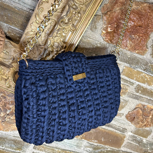 Handmade blue crochet shoulder bag, featuring a gold chain strap, side keychain, zipper closure, and inner lining
