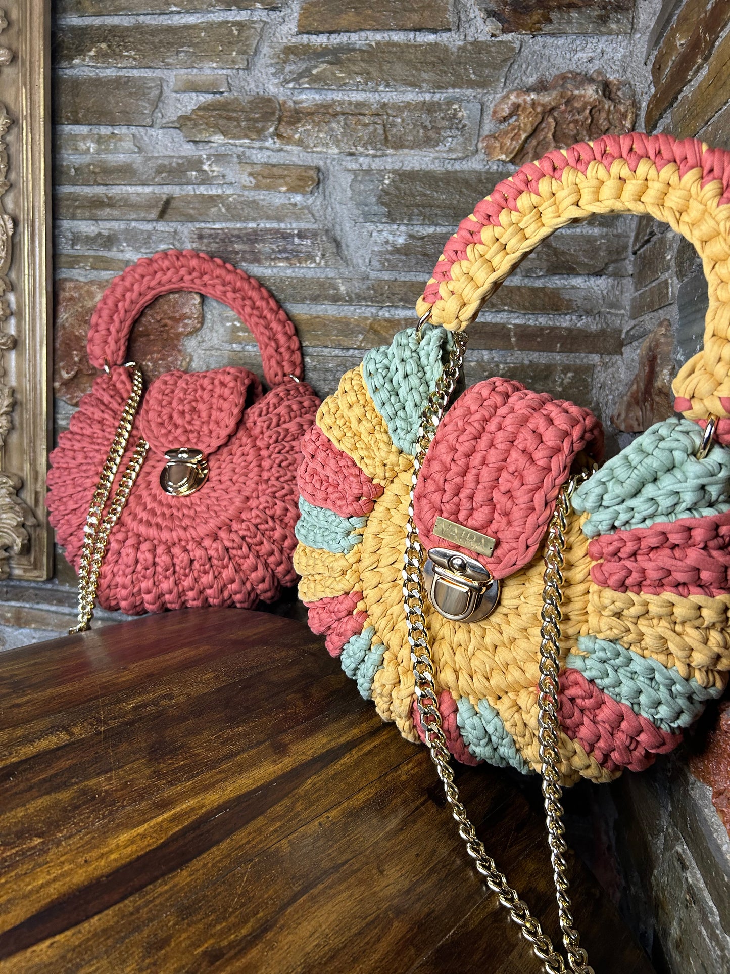 Handmade round multicolor crochet shoulder bag, featuring a metal and thread strap.