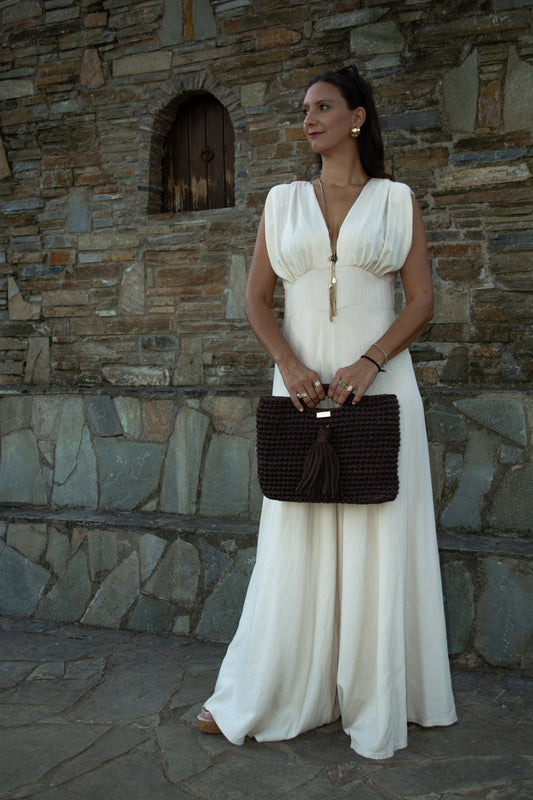 Elegant women's jumpsuit with shoulder pads and deep neckline in lightweight tequila fabric