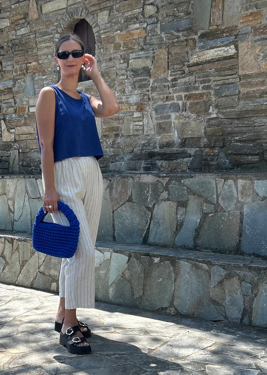 Women's sleeveless tank top with back buttons — lightweight fabric and modern minimal design for everyday wear.
