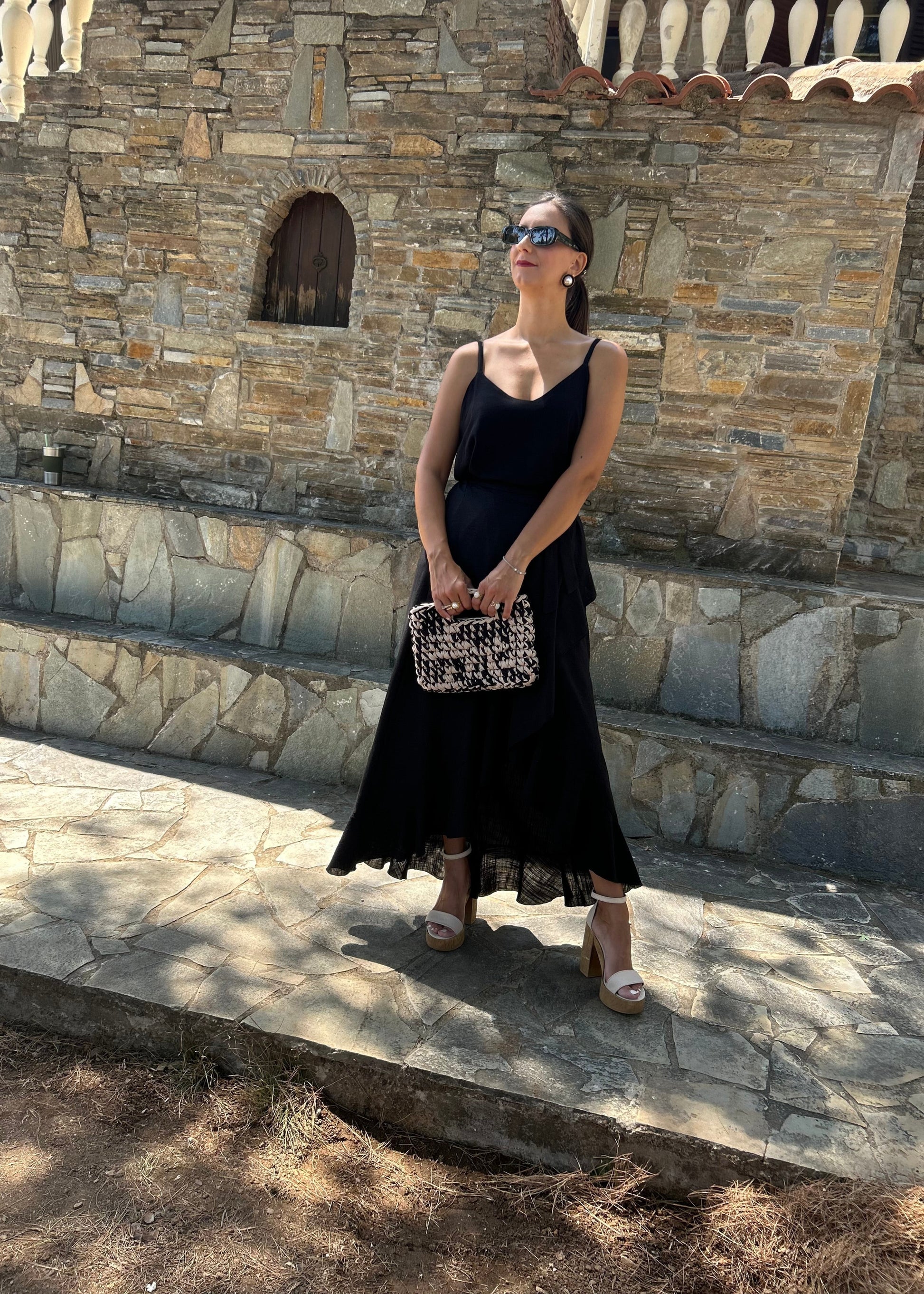 Women's black skirt with side slit and artistic detailing — elegant, feminine, and designed to turn heads.