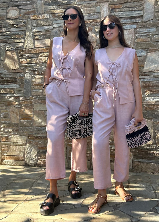 Romantic women's two-piece set featuring a sleeveless top with bow details and a lightweight tequila fabric capri pant with elastic waist – elegant and comfortable for all-day wear