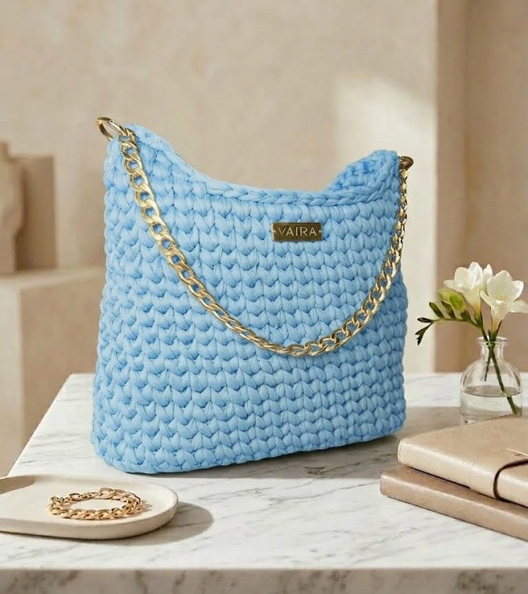 Handmade light blue crochet shoulder bag, lined interior, youthful and modern design